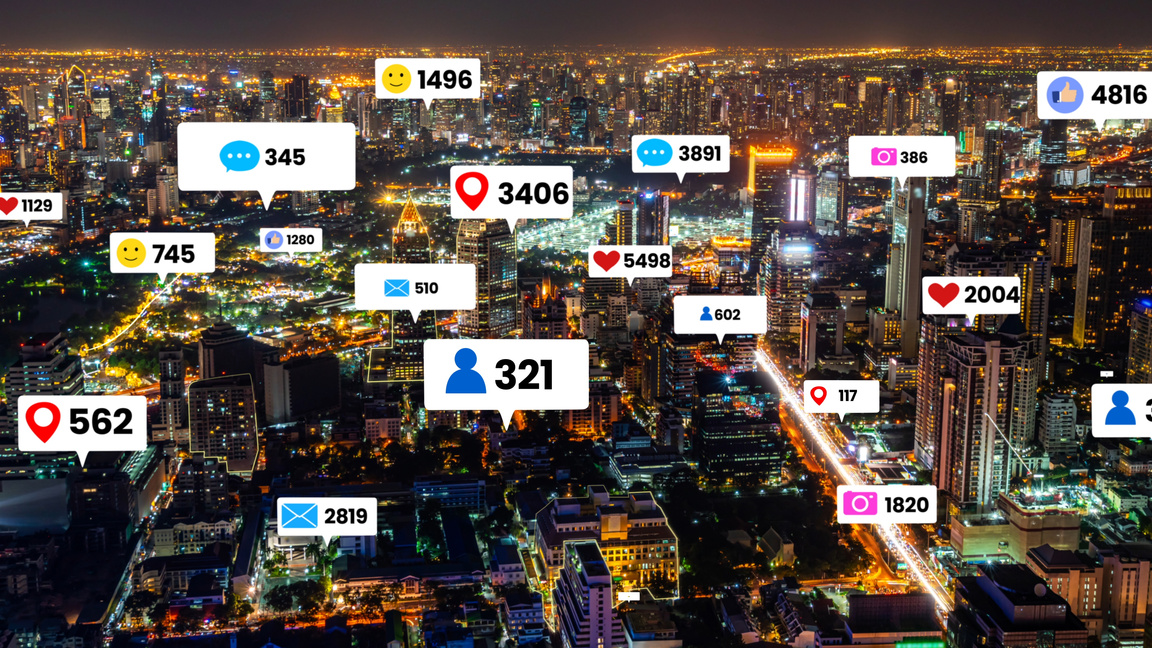 Social media icons fly over city downtown showing people engagement connection